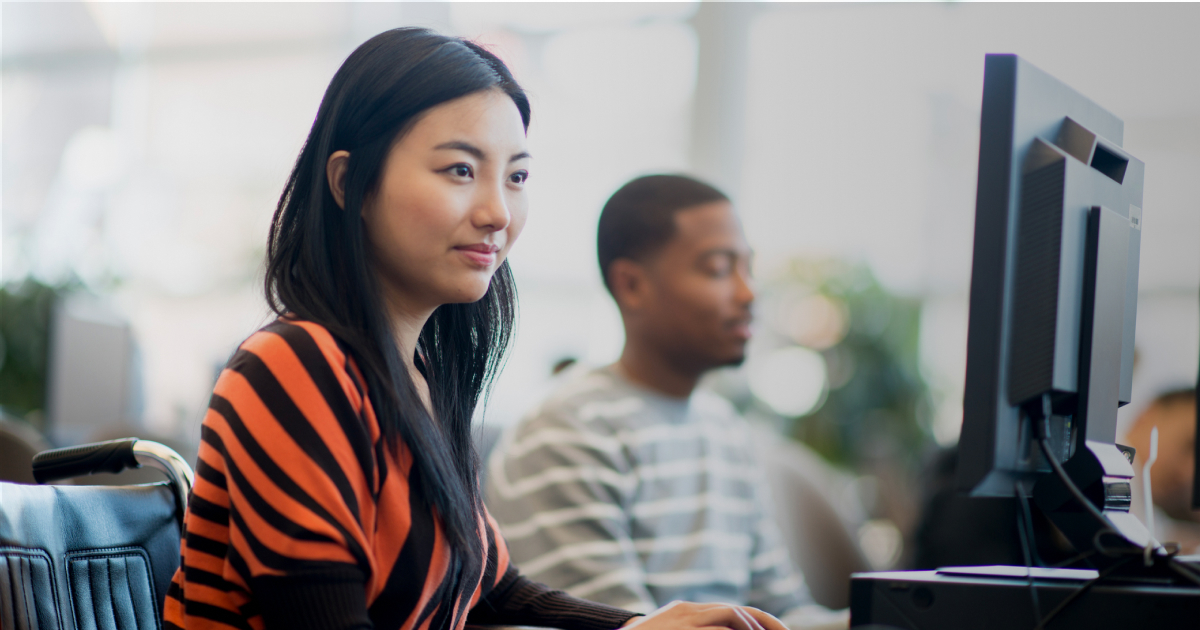 Young teacher candidate looking at computer monitor